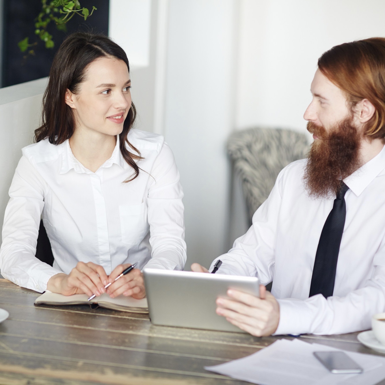recruiter-smiling-and-shaking-hands-with-employee-at-job-interview-in-office.jpg