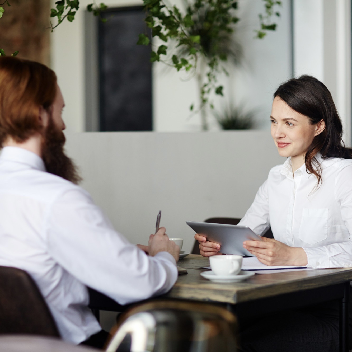 businesswomen-holding-clipboard-reading-recruiter-cv.jpg